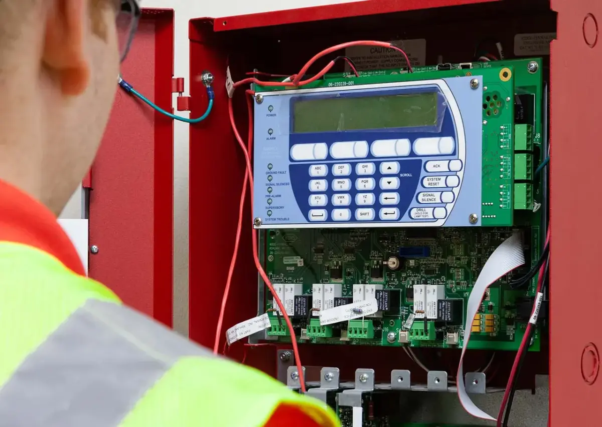 Marine fire alarm control panel with illuminated indicators