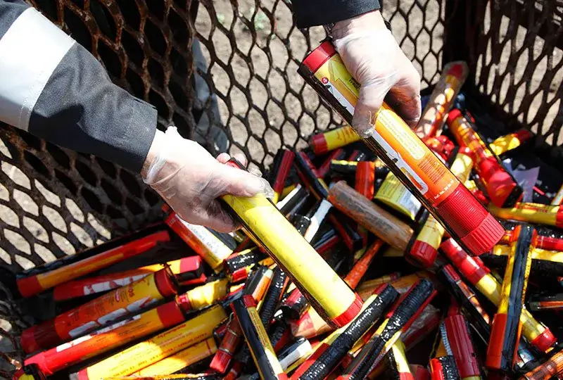Marine pyrotechnic distress signals being handled